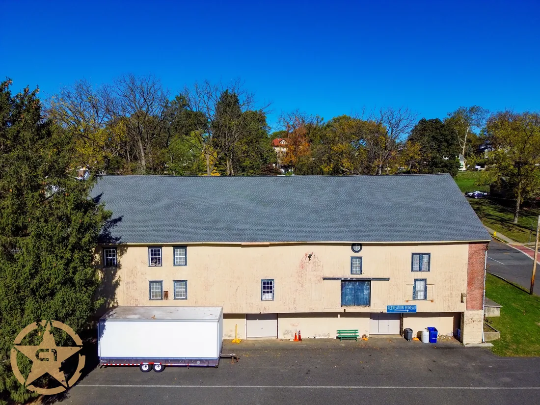 Completed shingle roof on a large historic commercial building at 3000 Parkway Boulevard, Allentown
